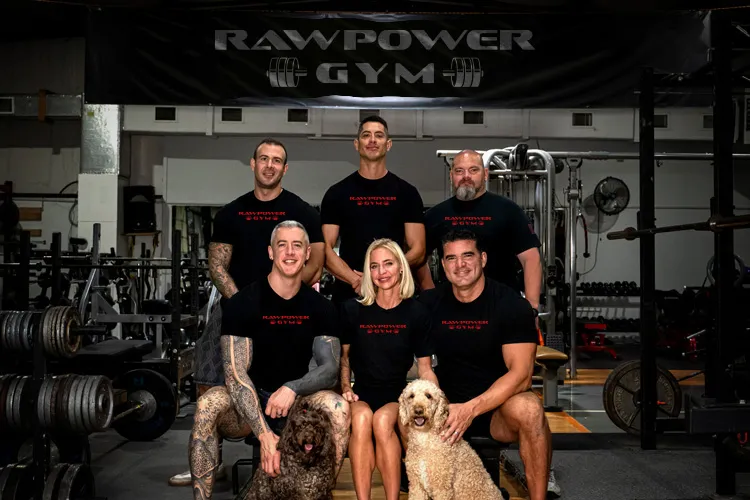 The coaches of Spicewood Fitness together on the gym floor.